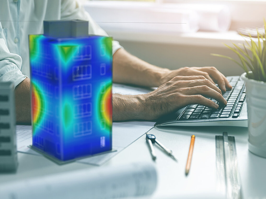an-engineer-at-his-desk-simulates-the-vibrations-of-a-high-rise-building-with-the-finite-element-analysis-software-waveimage--